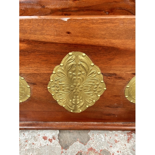 14 - An Indian sheesham wood blanket box with brass detailing