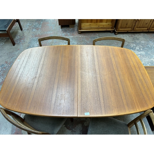 19 - A mid 20th century teak extending dining table and four G Plan teak dining chairs - approx. 250cm wh... 