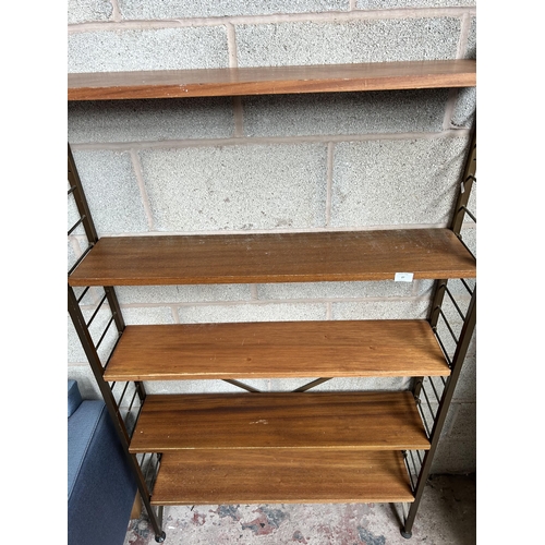 27 - A 1960s teak and brown metal five tier shelving unit - approx. 162cm high x 94cm wide x 20cm deep