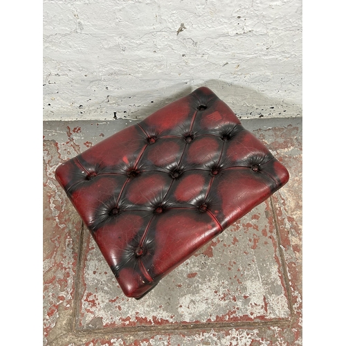 34 - An oxblood leather Chesterfield footstool with cabriole supports