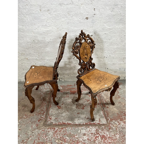 39 - Two 19th century Black Forest carved and inlaid walnut hall chairs, circa 1880 - approx. 92cm high x... 