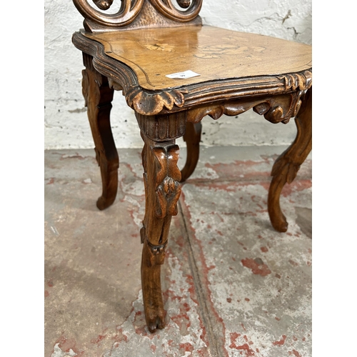 39 - Two 19th century Black Forest carved and inlaid walnut hall chairs, circa 1880 - approx. 92cm high x... 