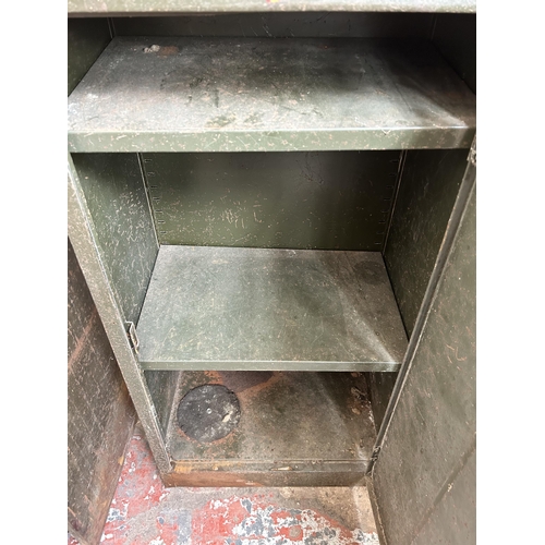 42 - A mid 20th century Valor military green metal single door cabinet