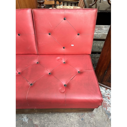 44 - A 1950s red vinyl two seater modular restaurant bench