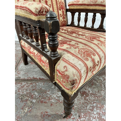 5 - An Edwardian carved oak and fabric upholstered armchair