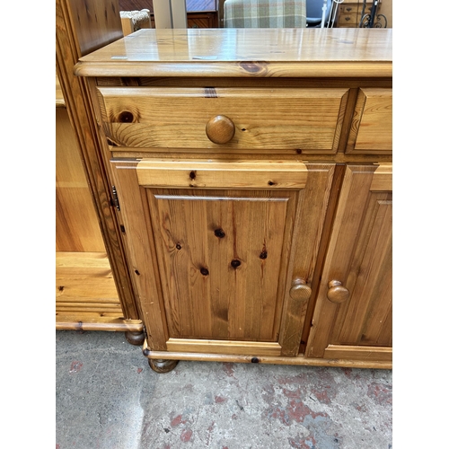 51 - A Ducal Victoria pine sideboard with three drawers and three cupboard doors