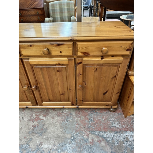 51 - A Ducal Victoria pine sideboard with three drawers and three cupboard doors