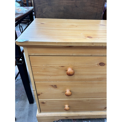 60 - A modern pine effect chest of three drawers