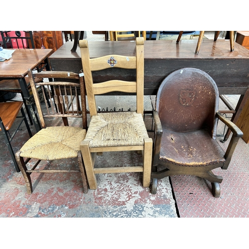 72 - Three chairs, early 20th century beech spindle back rush seated, modern beech ladder back rush seate... 