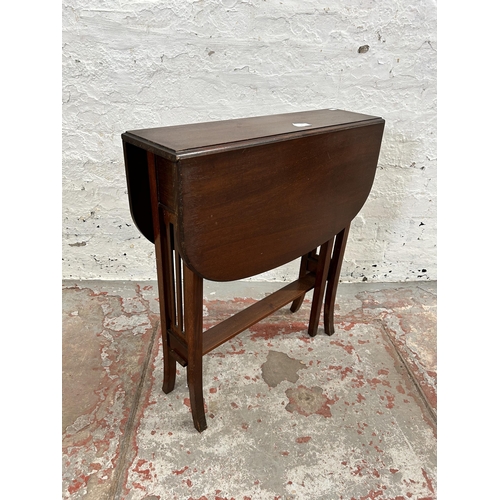 75 - An Edwardian mahogany drop leaf Sutherland table