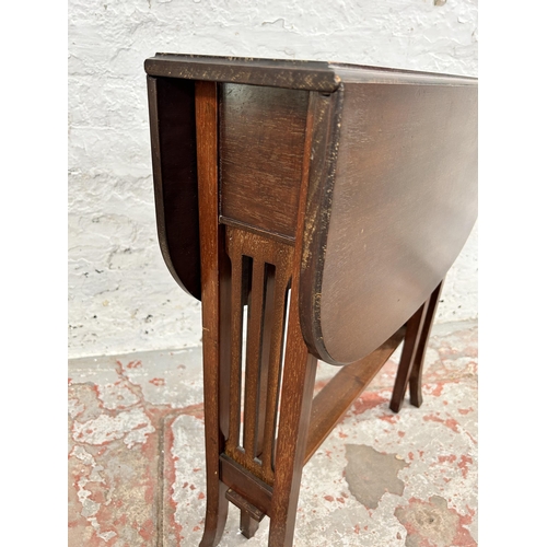 75 - An Edwardian mahogany drop leaf Sutherland table