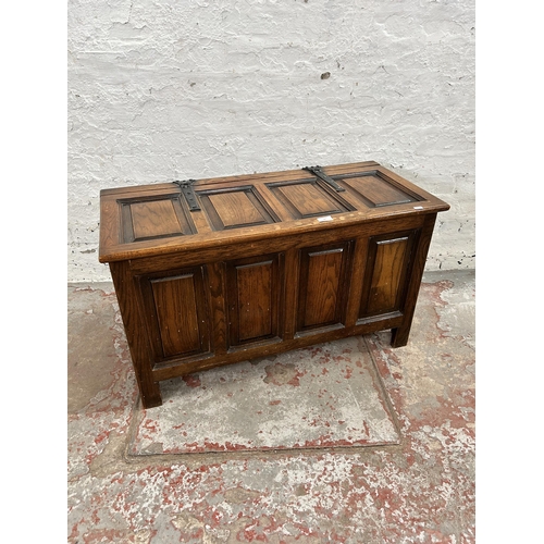 76 - An oak four panel blanket box