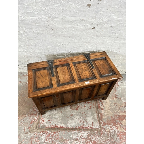 76 - An oak four panel blanket box