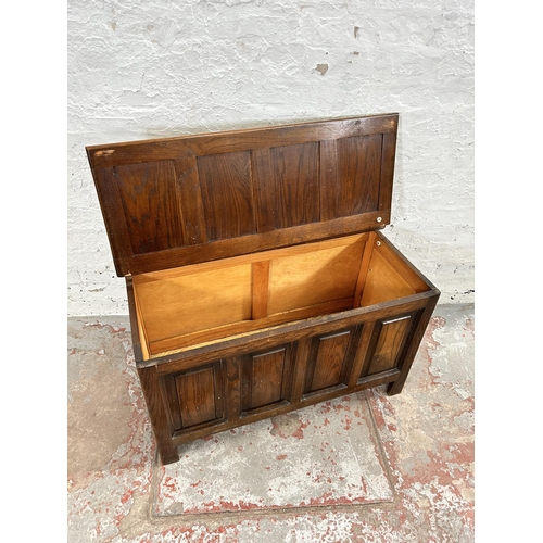 76 - An oak four panel blanket box