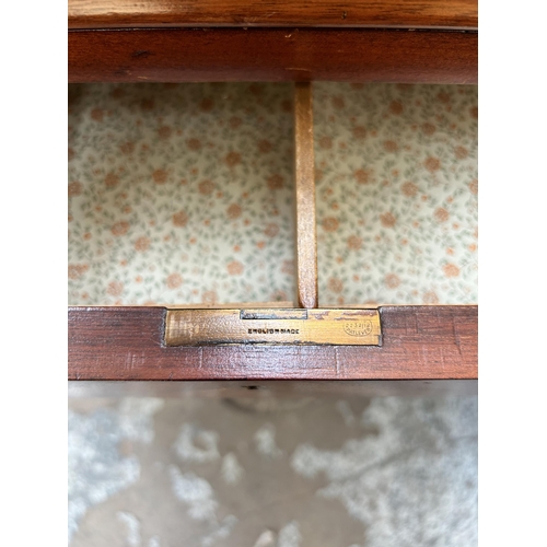 80 - An early 20th century mahogany bureau with three drawers, fall front and cabriole supports