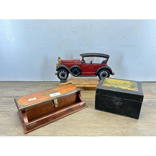 673 - Three items, Indian hardwood and brass desk tidy, early 20th century ebonised and papier-mâché tea c... 