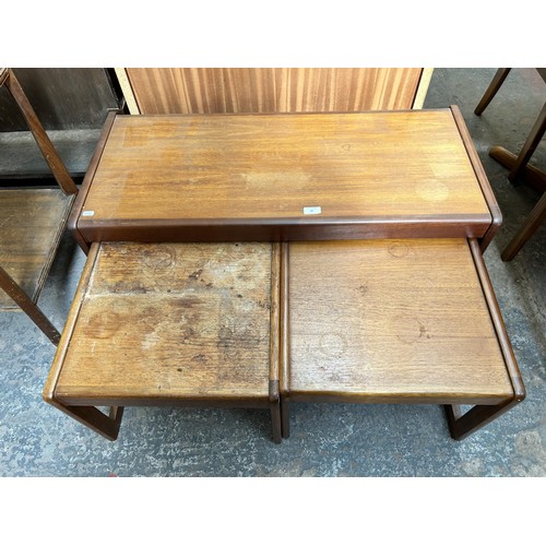 49 - A 1960s teak nest of three tables