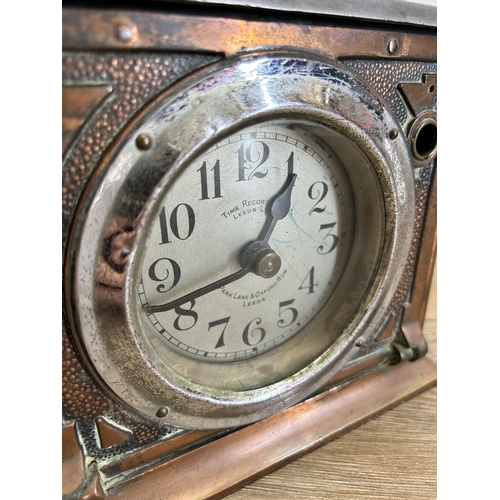 676 - An early 20th century Time Recorders Ltd. of Leeds copper and steel clocking in machine - approx. 27... 