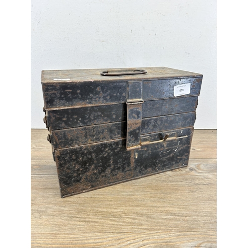 678 - An early/mid 20th century black metal cantilever three section medical box with contents