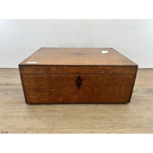 681 - A 19th century oak work box with rosewood escutcheon and cartouche - approx. 13cm high x 31cm wide x... 