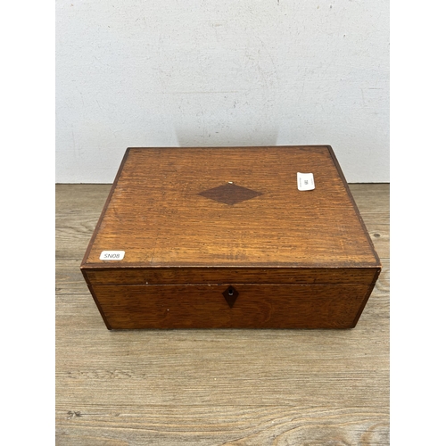 681 - A 19th century oak work box with rosewood escutcheon and cartouche - approx. 13cm high x 31cm wide x... 