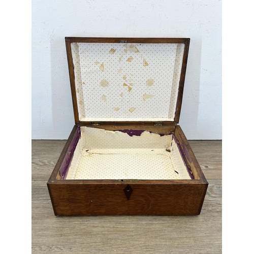 681 - A 19th century oak work box with rosewood escutcheon and cartouche - approx. 13cm high x 31cm wide x... 