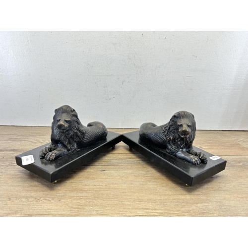 685 - A pair of bronze lion figurines on black marble plinths - approx. 14cm high x 23.5cm wide x 11cm dee... 