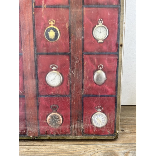 692 - A display case containing sixteen quartz collectors pocket watches