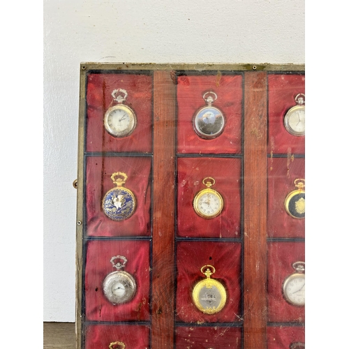 692 - A display case containing sixteen quartz collectors pocket watches