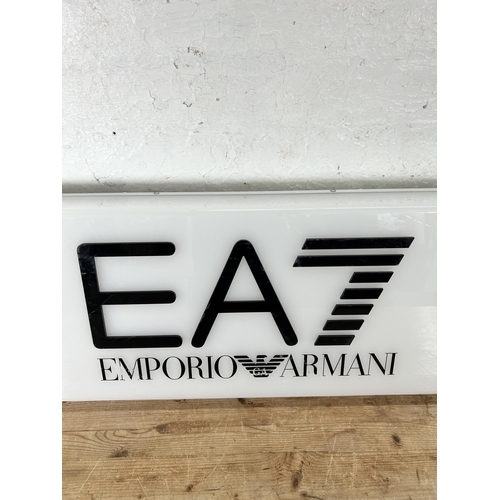 700 - An Emporio Armani illuminating advertising sign - approx. 35cm high x 122cm wide