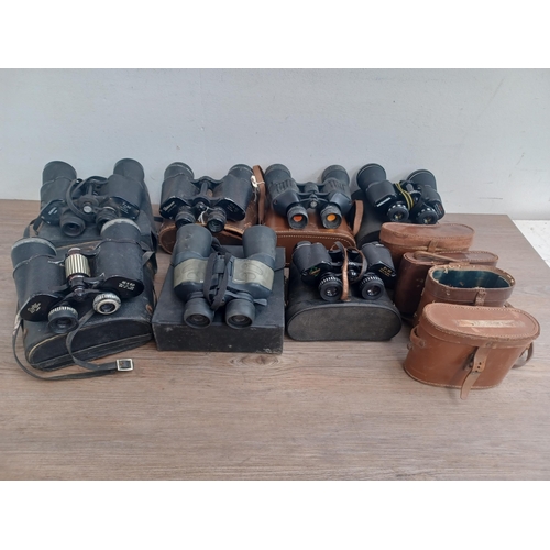 802 - Seven pairs of binoculars to include Chinon, Greenkat 8 x 30, Palar 16 x 50, Pathéscope 10 x 50, Mir... 