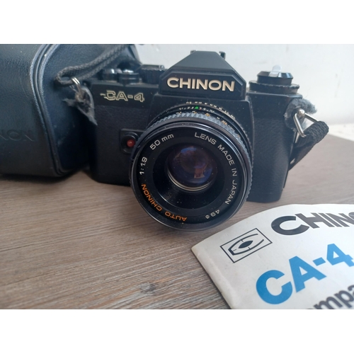 803 - A collection of items to include cased Chinon CA-4 35mm SLR camera with instruction manual, boxed Ca... 