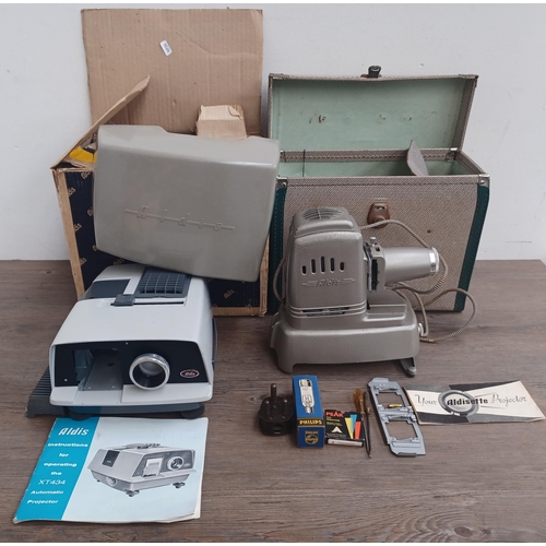 805 - Two Aldis slide projectors with instructions, one boxed XT434 automatic and one cased Aldisette