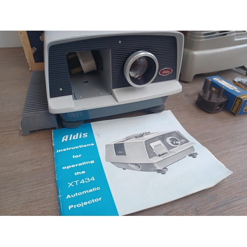 805 - Two Aldis slide projectors with instructions, one boxed XT434 automatic and one cased Aldisette