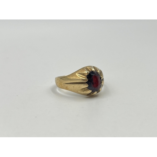 1187 - A hallmarked London 9ct gold textured garnet solitaire ring, size U - approx. gross weight 4.91 gram... 