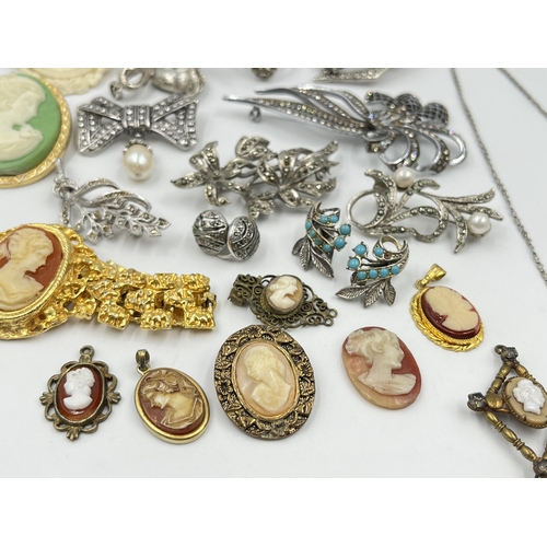 1201 - A collection of vintage costume jewellery to include cameo dress rings, cameo brooches etc.