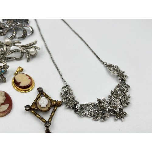 1201 - A collection of vintage costume jewellery to include cameo dress rings, cameo brooches etc.