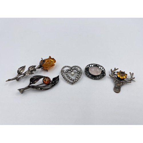 1204 - Five silver brooches to include amber rose, amber leaf etc.