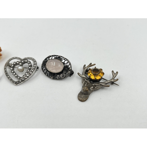 1204 - Five silver brooches to include amber rose, amber leaf etc.