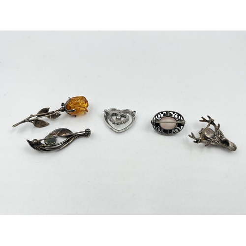 1204 - Five silver brooches to include amber rose, amber leaf etc.