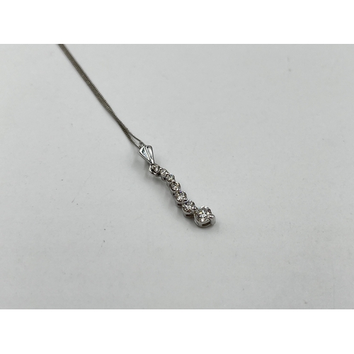 1214 - A hallmarked 18ct white gold diamond static pendant on 9ct white gold chain necklace - approx. gross... 