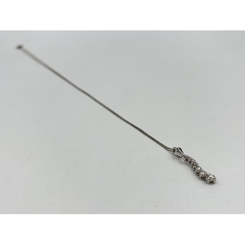 1214 - A hallmarked 18ct white gold diamond static pendant on 9ct white gold chain necklace - approx. gross... 