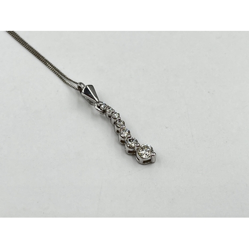 1214 - A hallmarked 18ct white gold diamond static pendant on 9ct white gold chain necklace - approx. gross... 