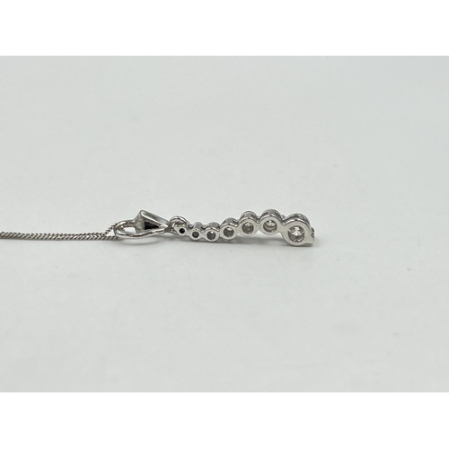 1214 - A hallmarked 18ct white gold diamond static pendant on 9ct white gold chain necklace - approx. gross... 