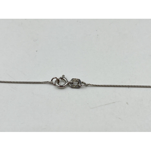 1214 - A hallmarked 18ct white gold diamond static pendant on 9ct white gold chain necklace - approx. gross... 