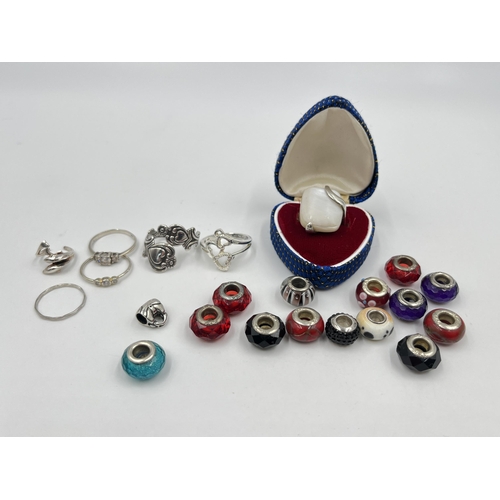 1215 - A collection of .925 silver rings and charms