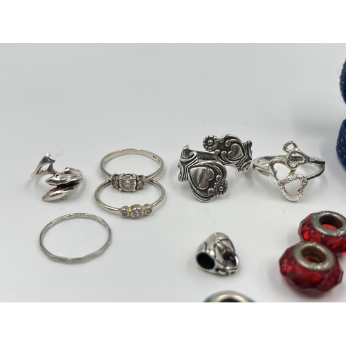 1215 - A collection of .925 silver rings and charms