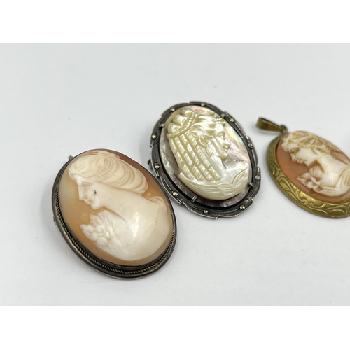 1218 - Five vintage cameo pendants/brooches, four .800 silver and one brass