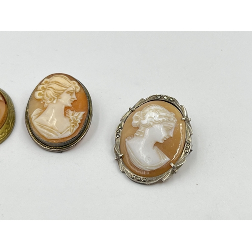 1218 - Five vintage cameo pendants/brooches, four .800 silver and one brass