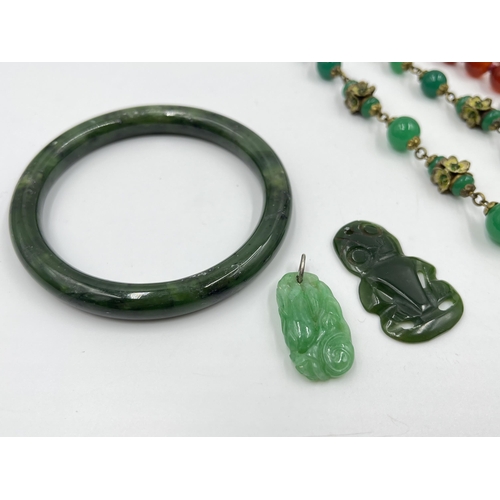 1220 - Five pieces of Oriental gemstone jewellery to include carnelian amulet pendant necklace with silver ... 